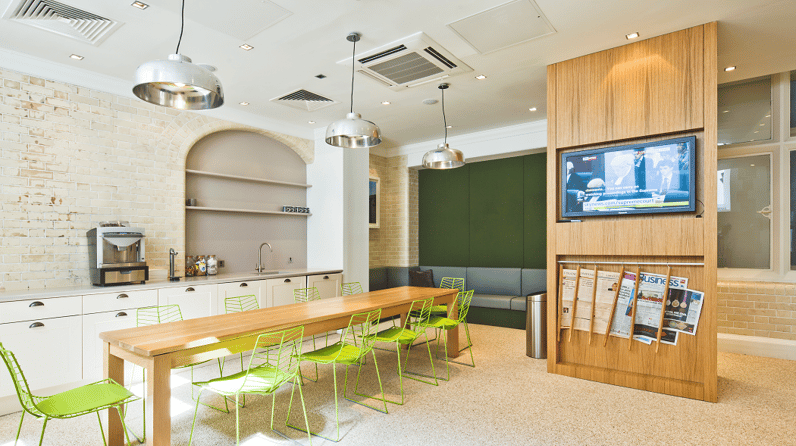 Green Park House's vibrant kitchen with bright green chairs