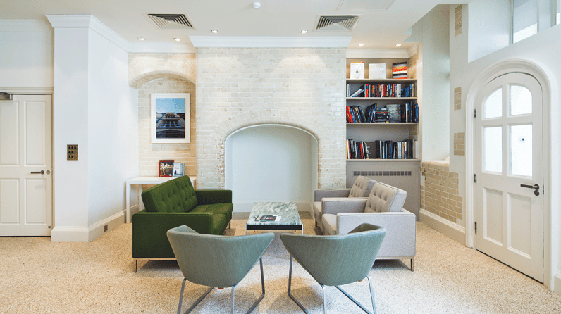 Green Park House's vibrant kitchen with bright green chairs